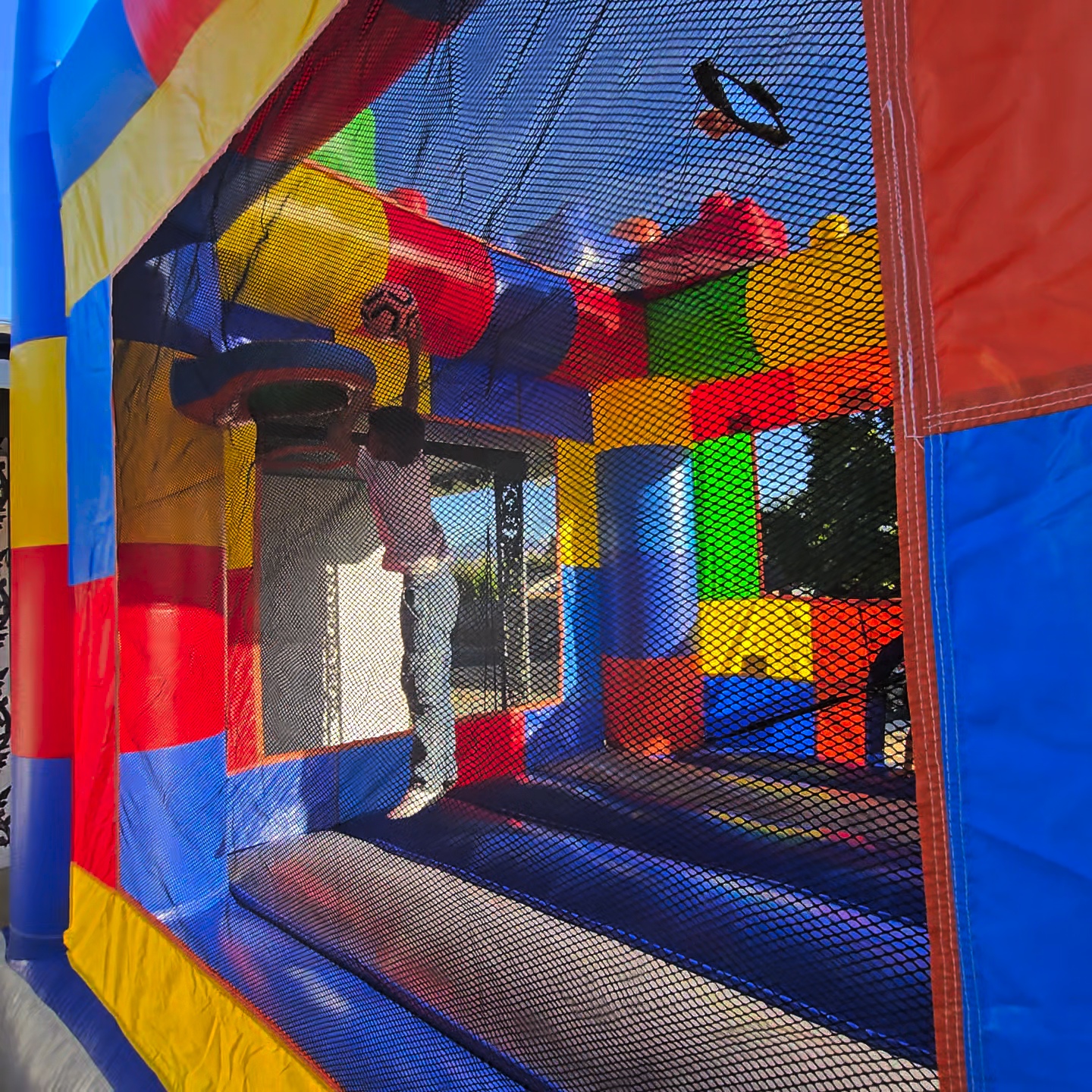 LEGO bounce house interior with safety net enclosure