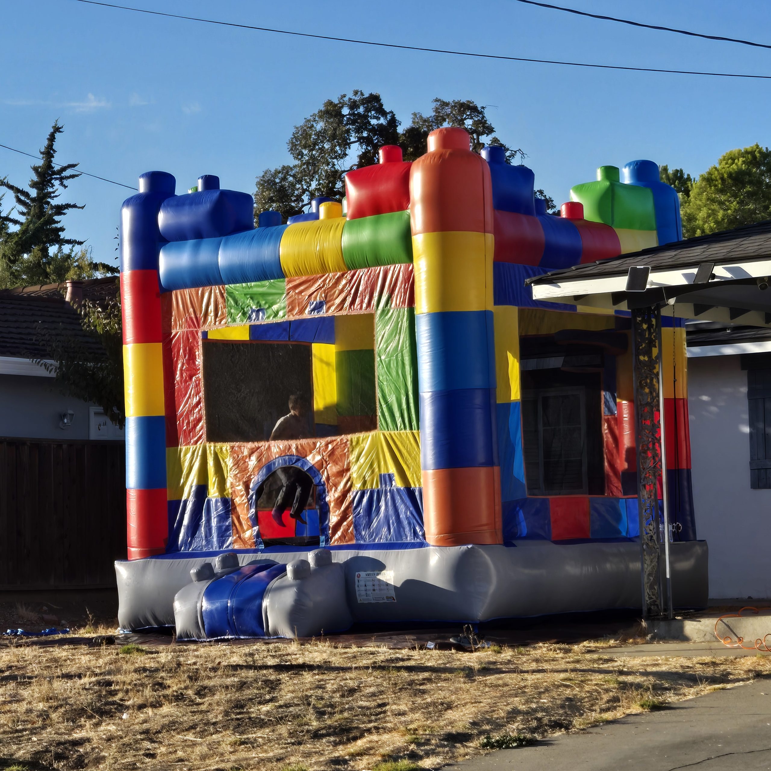 LEGO bounce house rental backyard setup for birthday party